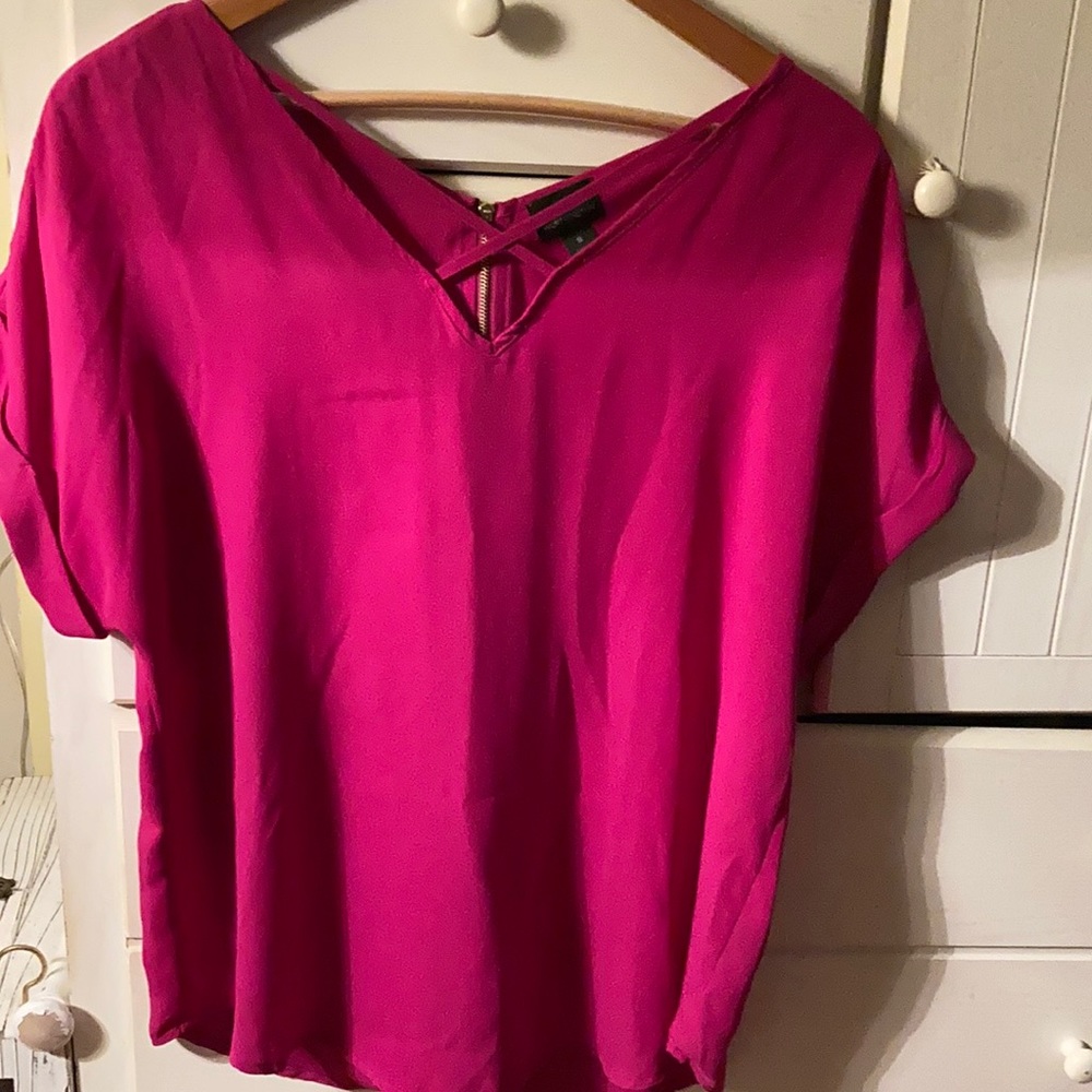 Cute pink top with cross cross front and zip back